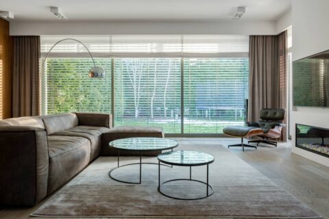 A large window featuring blinds and drapes near Richmond, VA