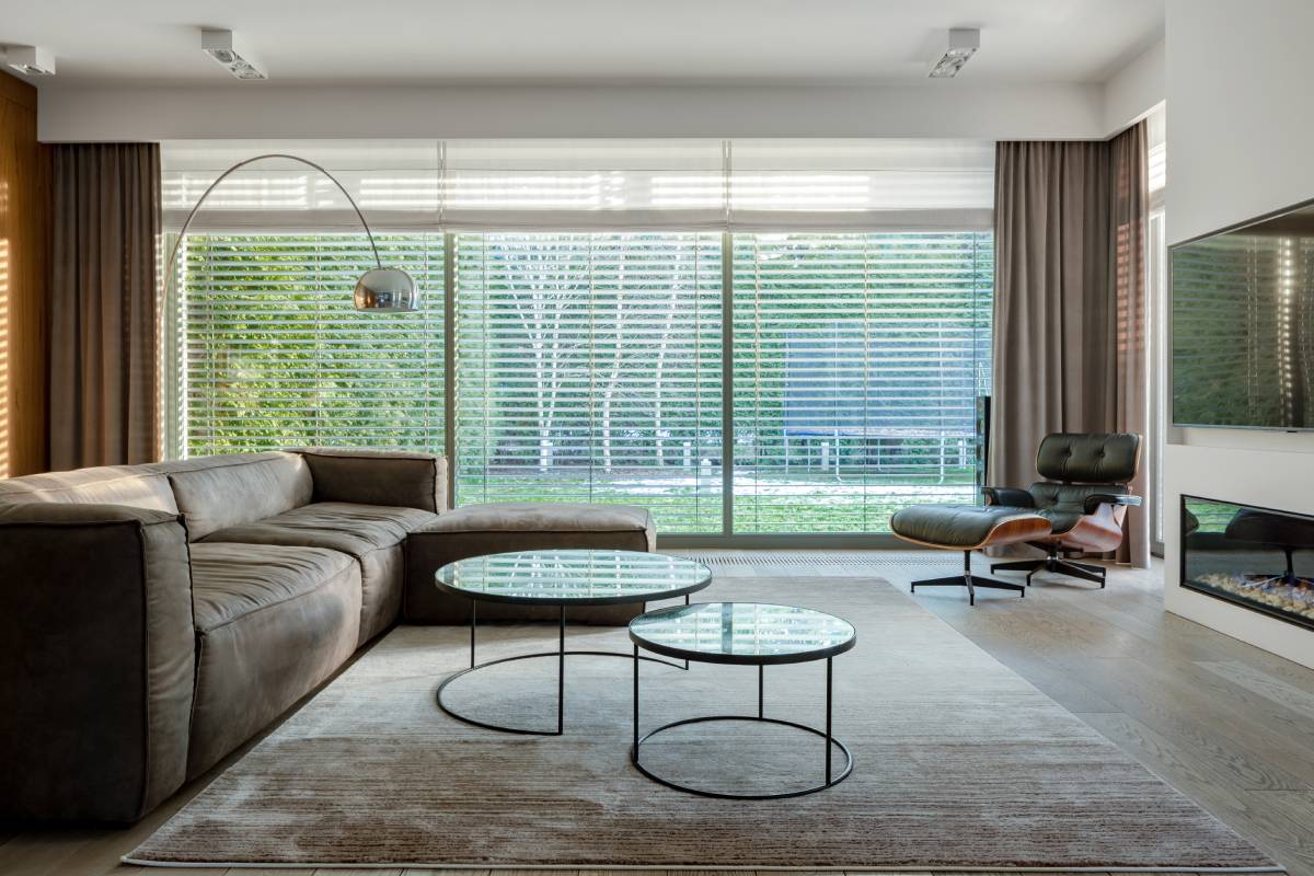 A large window featuring blinds and drapes near Richmond, VA