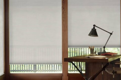 Hunter Douglas Duette® Cellular Shades blocking light in a home office near Richmond, VA.