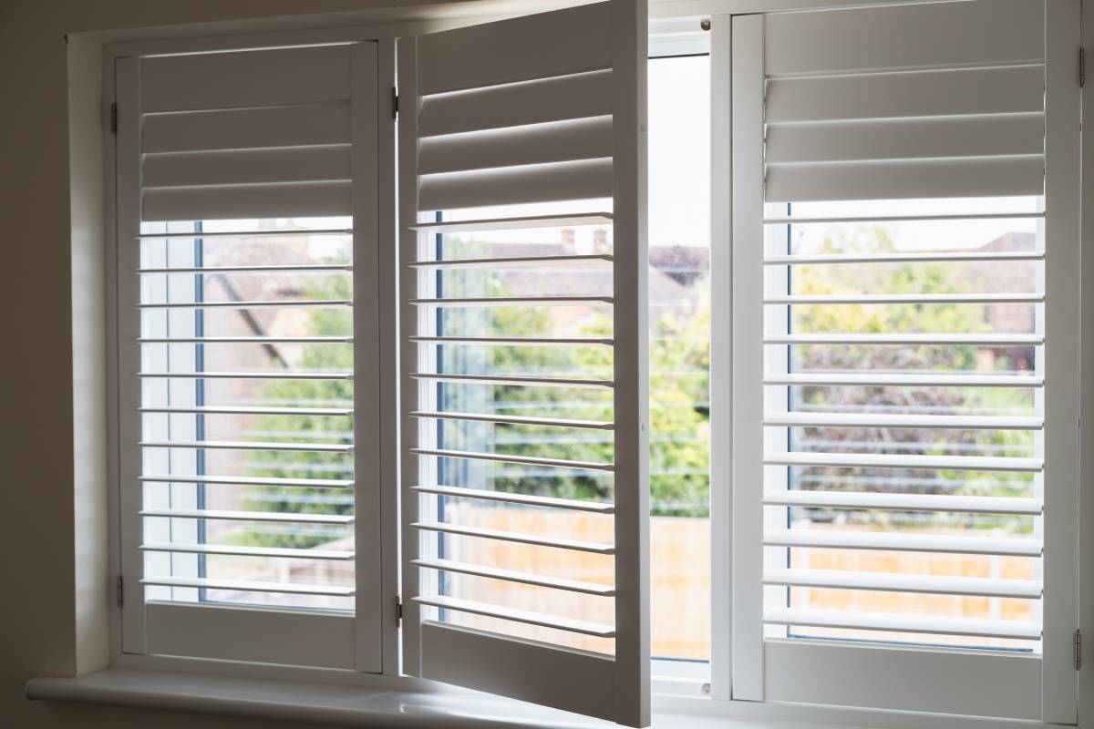 Set of plantation shutters on a bedroom window at Andrew Norris And Associates near Richmond, VA 