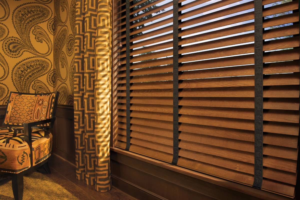 Hunter Douglas wood blinds covering a window in an eclectic living room near Richmond, VA