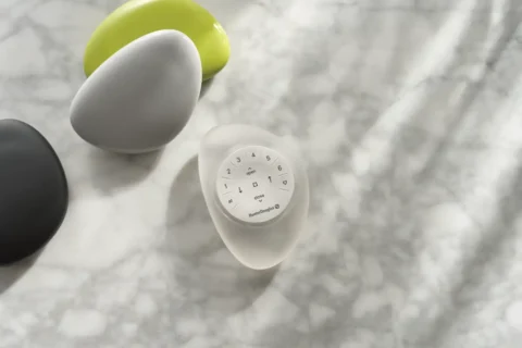 Hunter Douglas PowerView® Automation remote on a kitchen counter.